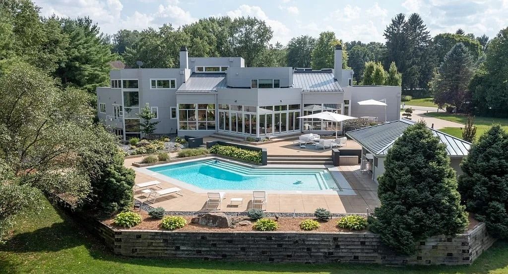 The Masterpiece in Akron offers 3 amazing levels and stunning backyard oasis complete with pool, extensive patios, now available for sale. This home located at 4735 Mallard Pond Dr, Akron, Ohio