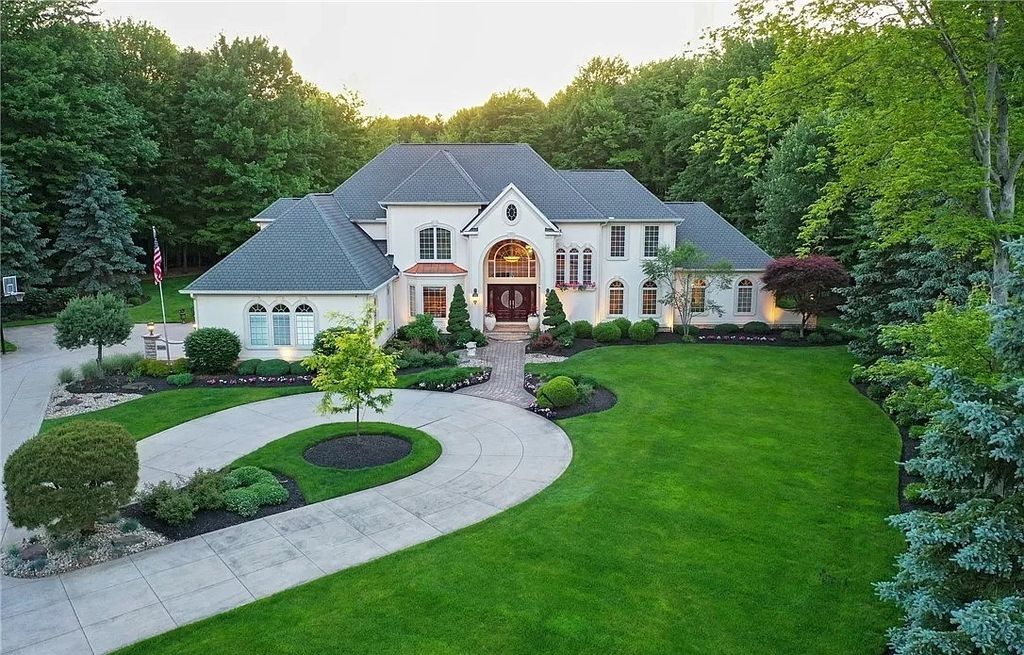 The Home in Solon offers elegant architectural details, exceptional craftsmanship, and resort-style entertaining areas, now available for sale. This home located at 36895 Halton Ct, Solon, Ohio