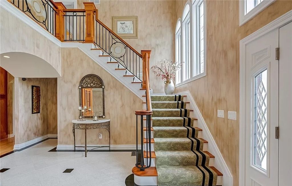 The Home in Solon offers elegant architectural details, exceptional craftsmanship, and resort-style entertaining areas, now available for sale. This home located at 36895 Halton Ct, Solon, Ohio