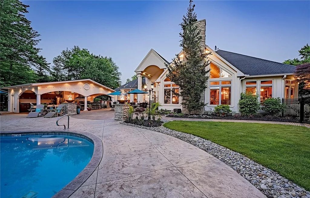 The Home in Solon offers elegant architectural details, exceptional craftsmanship, and resort-style entertaining areas, now available for sale. This home located at 36895 Halton Ct, Solon, Ohio