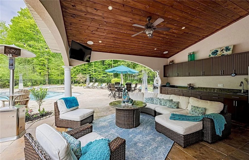 The Home in Solon offers elegant architectural details, exceptional craftsmanship, and resort-style entertaining areas, now available for sale. This home located at 36895 Halton Ct, Solon, Ohio