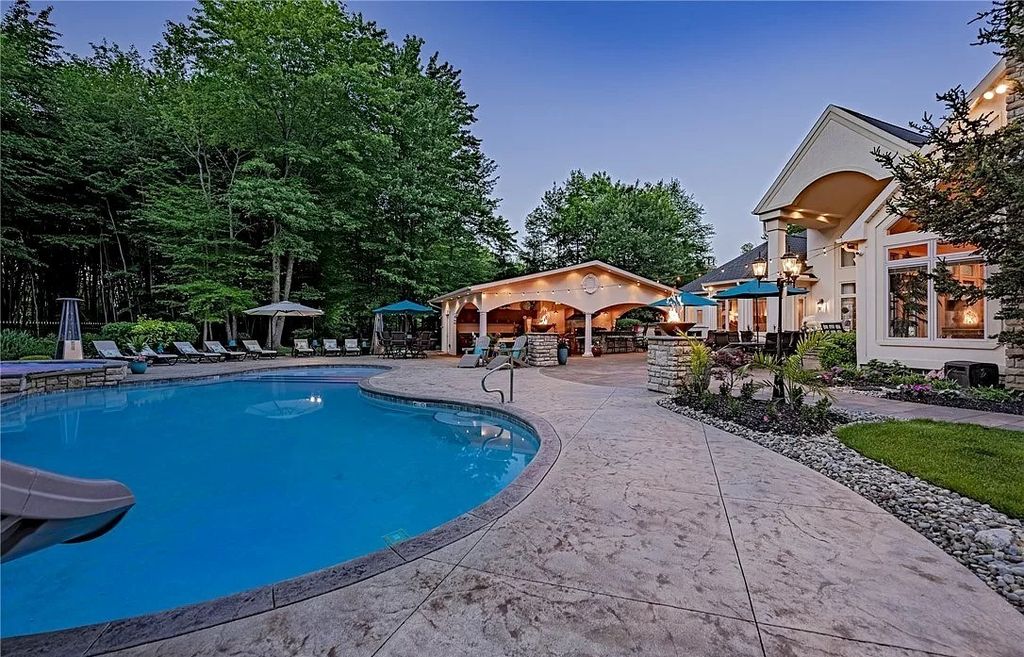 The Home in Solon offers elegant architectural details, exceptional craftsmanship, and resort-style entertaining areas, now available for sale. This home located at 36895 Halton Ct, Solon, Ohio
