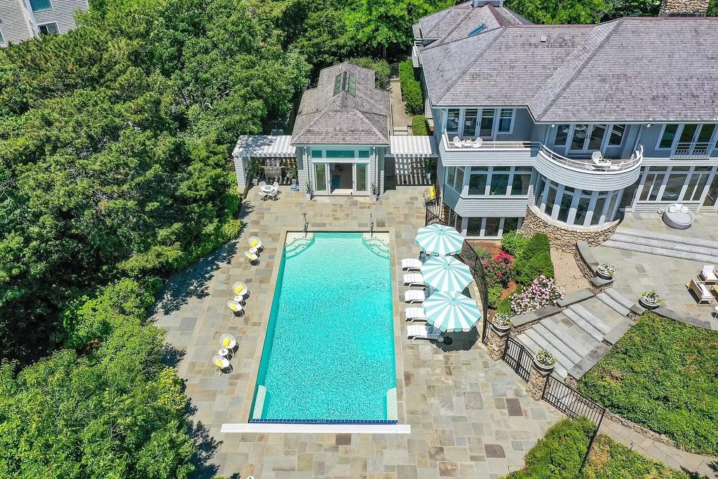 The Estate in Mashpee boasts every imaginable amenity for any occasion and total privacy with a breathtaking backdrop, now available for sale. This home located at 78 Triton Way, Mashpee, Massachusetts