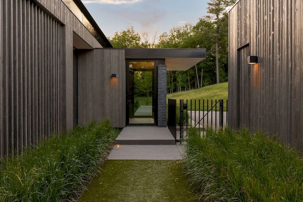 Minnetonka Minimalism house with the glass walls by Charlie & Co. Design