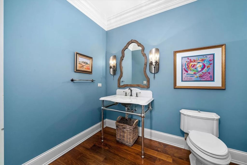 Do not make them simple and rustic just because your bathroom is small. The homeowner made a statement in the Saint Charles estate space with soft blue walls and "flying" decorations.