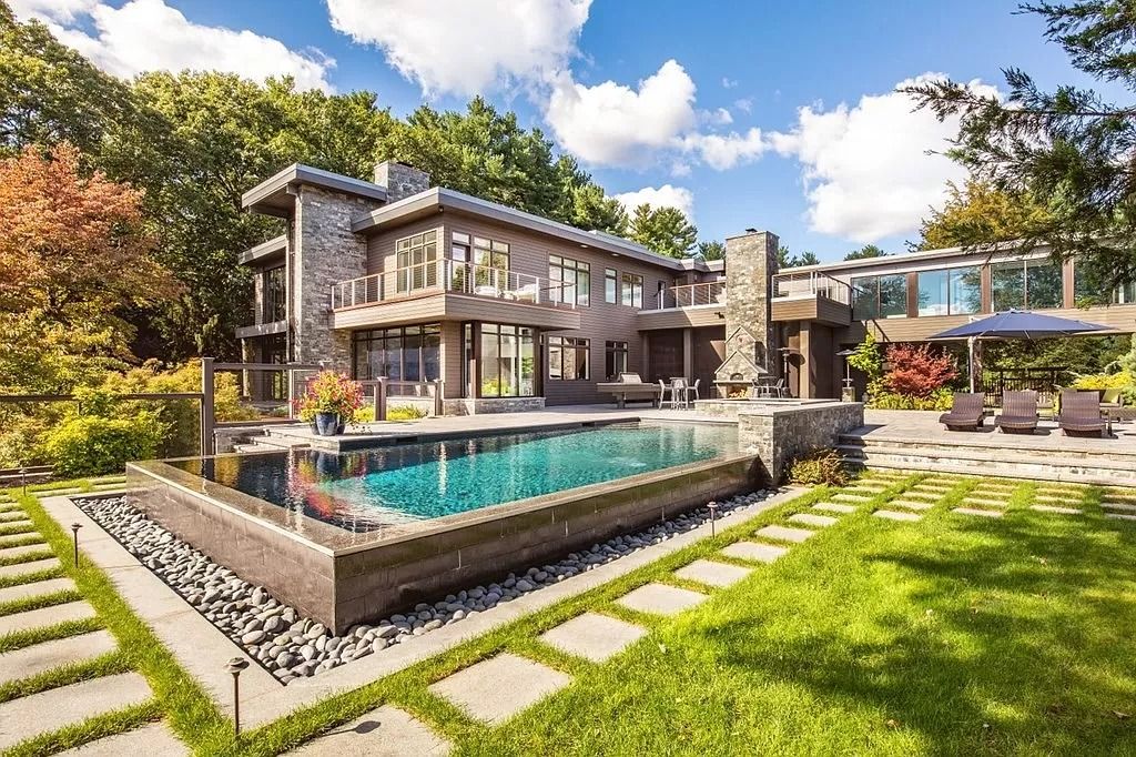 The Estate in Westwood is a luxurious home perfectly set at the end of a secluded acres now available for sale. This home located at 300 Summer St, Westwood, Massachusetts; offering 06 bedrooms and 09 bathrooms with 10,309 square feet of living spaces. 