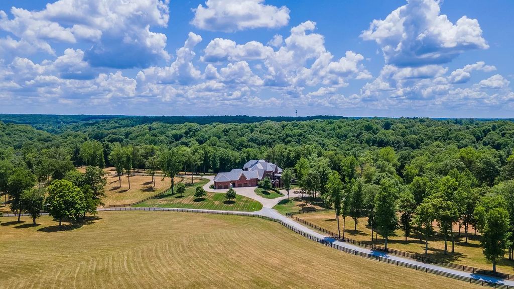 The Estate in Ashland City is a luxurious home with marble tiled floors and walls in each bath, hardwoods throughout, now available for sale. This home located at 2925 Old Clarksville Pike, Ashland City, Tennessee