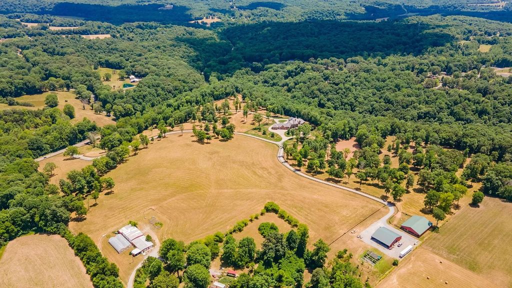 The Estate in Ashland City is a luxurious home with marble tiled floors and walls in each bath, hardwoods throughout, now available for sale. This home located at 2925 Old Clarksville Pike, Ashland City, Tennessee