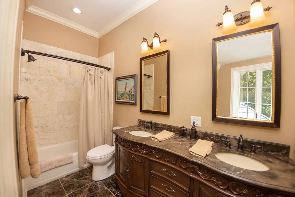 The Estate in Ashland City is a luxurious home with marble tiled floors and walls in each bath, hardwoods throughout, now available for sale. This home located at 2925 Old Clarksville Pike, Ashland City, Tennessee