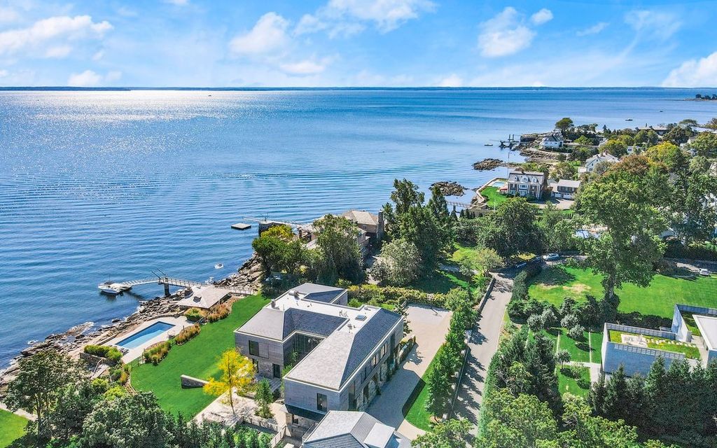 The Estate in Old Greenwich is a true oasis with 200'+ water frontage, pool,  expansive terraces integrated with gardens and deep water pier, now available for sale. This home located at 45 Binney Ln, Old Greenwich, Connecticut