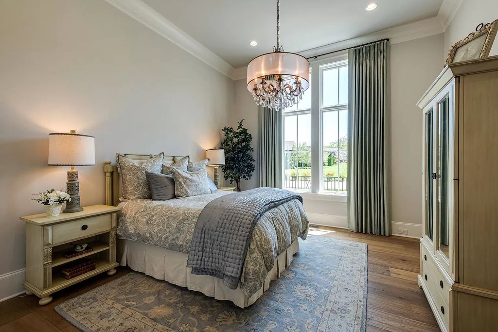 Eye-catching metal sculptures and chrome accents that emphasize the chilly tones and contrast the warmer neutrals are used to break up the neutral space in this bedroom. It is warm and inviting yet sleek and sophisticated due to the rich layers of texture.