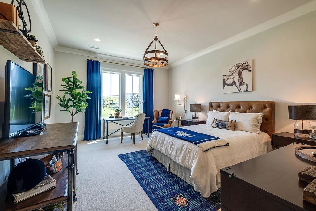 Eye-catching metal sculptures and chrome accents that emphasize the chilly tones and contrast the warmer neutrals are used to break up the neutral space in this bedroom. It is warm and inviting yet sleek and sophisticated due to the rich layers of texture.