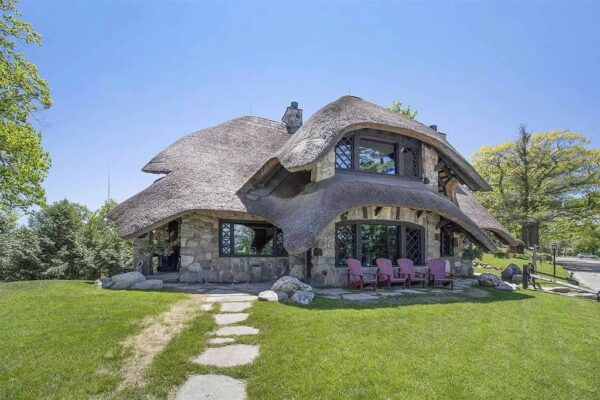 Unique and Bold in Charlevoix! This Thatch House Built with Specialized Timber Work Listed at $4.5M