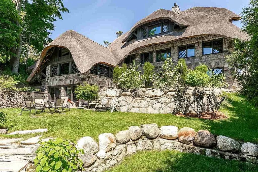 The Estate in Charlevoix is a luxurious home featuring beautifully flowing roof which is crafted from the finest natural thatch hand-reaped in Europe now available for sale. This home located at 304 Park Ave, Charlevoix, Michigan; offering 07 bedrooms and 07 bathrooms with 6,000 square feet of living spaces.