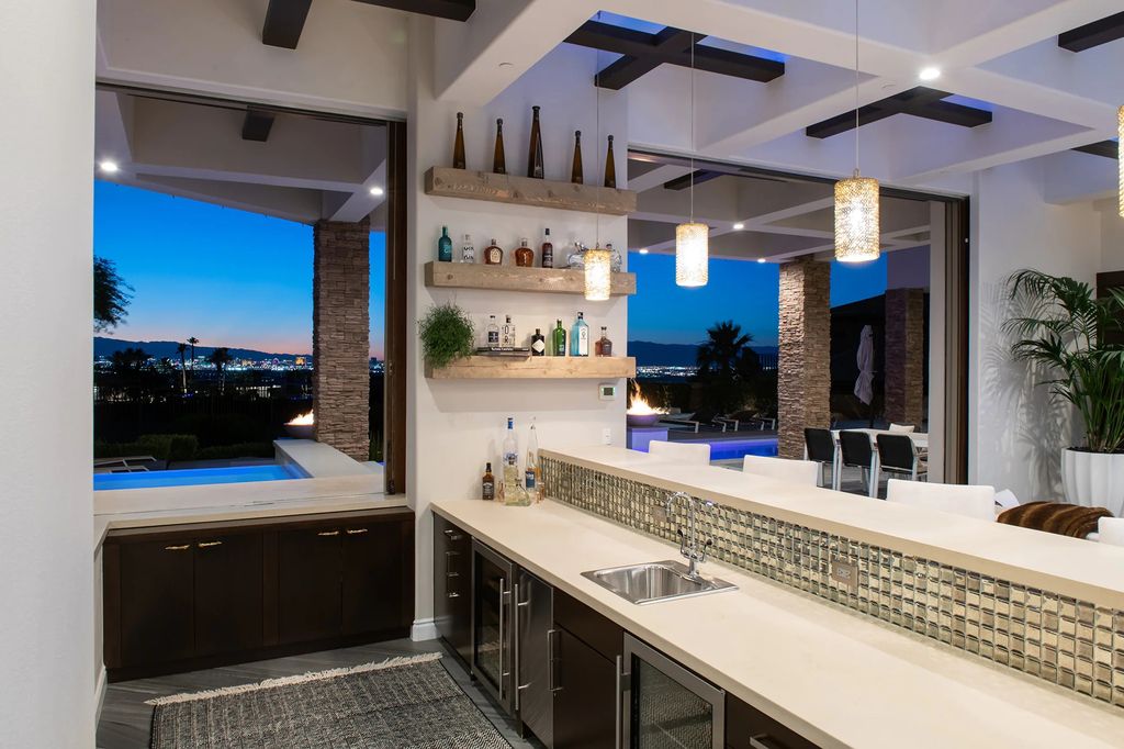 The Home in Henderson, a recently refurbished property has sleek, modern finishes and features a spectacular floating staircase, mountains and golf course views is now available for sale. This home located at 633 Saint Croix St, Henderson, Nevada