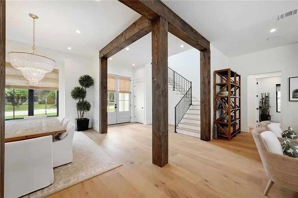 The Farmhouse in Austin, a luxurious home in the Lost Creek neighborhood of West Lake Hills featuring 10' and 11' ceilings throughout, a dedicated gym, half bath, and oversized laundry room adjacent to the kitchen is now available for sale. This home located at 6502 Huckleberry Cv, Austin, Texas