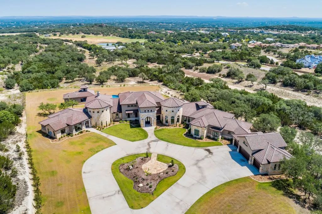 The Estate in Boerne, a one of a kind family compound with rolling hills, a stocked pond, and incredible hilltop views offers impressive entertainment amenities including resort style pool, outdoor kitchen, separate 4 car work shop, gun safe room and more is now available for sale. This home located at 186 Joe Klar Rd, Boerne, Texas