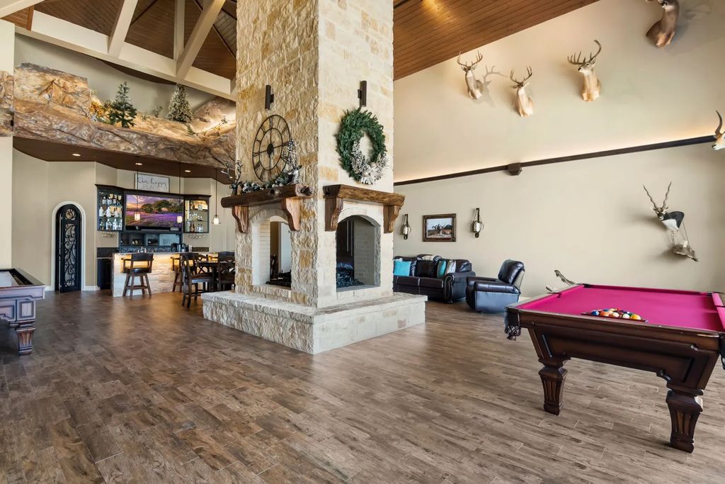 The Estate in Boerne, a one of a kind family compound with rolling hills, a stocked pond, and incredible hilltop views offers impressive entertainment amenities including resort style pool, outdoor kitchen, separate 4 car work shop, gun safe room and more is now available for sale. This home located at 186 Joe Klar Rd, Boerne, Texas