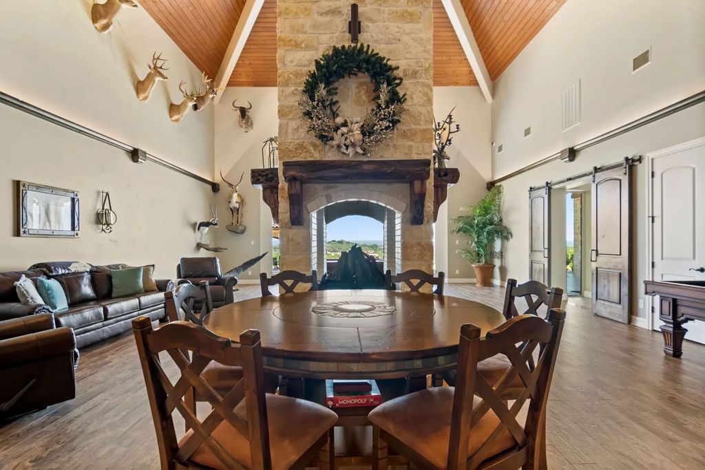 The Estate in Boerne, a one of a kind family compound with rolling hills, a stocked pond, and incredible hilltop views offers impressive entertainment amenities including resort style pool, outdoor kitchen, separate 4 car work shop, gun safe room and more is now available for sale. This home located at 186 Joe Klar Rd, Boerne, Texas
