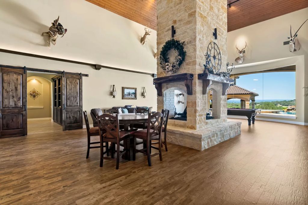 The Estate in Boerne, a one of a kind family compound with rolling hills, a stocked pond, and incredible hilltop views offers impressive entertainment amenities including resort style pool, outdoor kitchen, separate 4 car work shop, gun safe room and more is now available for sale. This home located at 186 Joe Klar Rd, Boerne, Texas