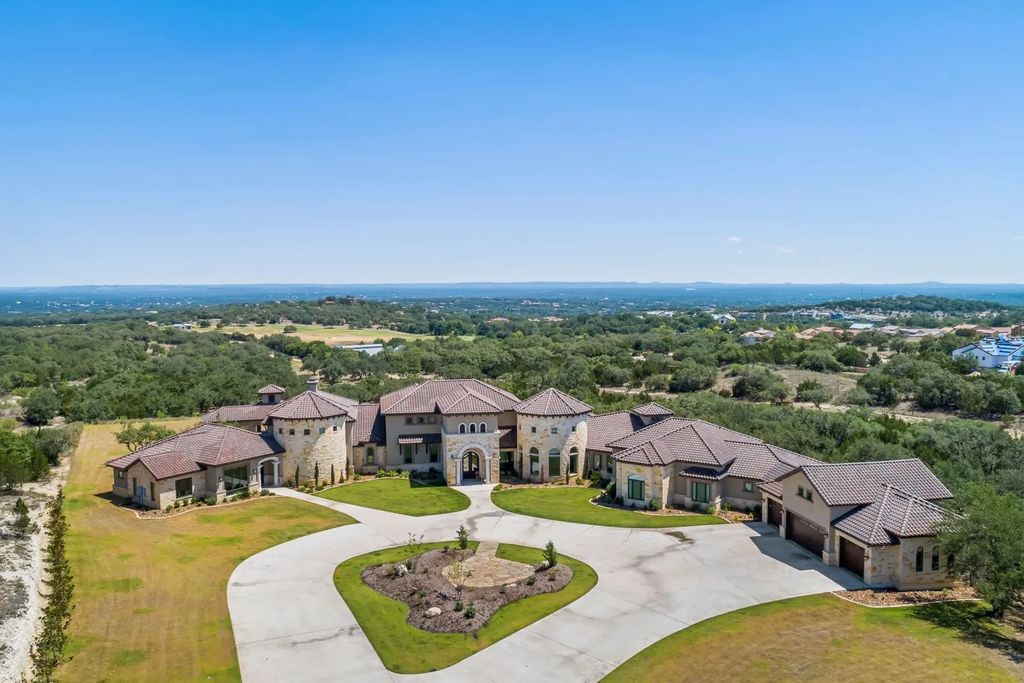 The Estate in Boerne, a one of a kind family compound with rolling hills, a stocked pond, and incredible hilltop views offers impressive entertainment amenities including resort style pool, outdoor kitchen, separate 4 car work shop, gun safe room and more is now available for sale. This home located at 186 Joe Klar Rd, Boerne, Texas