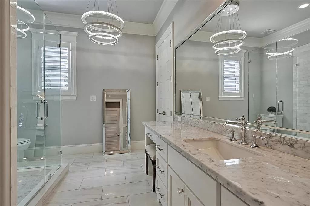 The Home in The Woodlands built for discerning clientele with the finest materials and upmost privacy for entertaining is now available for sale. This home located at 25 S Doe Run Dr, The Woodlands, Texas