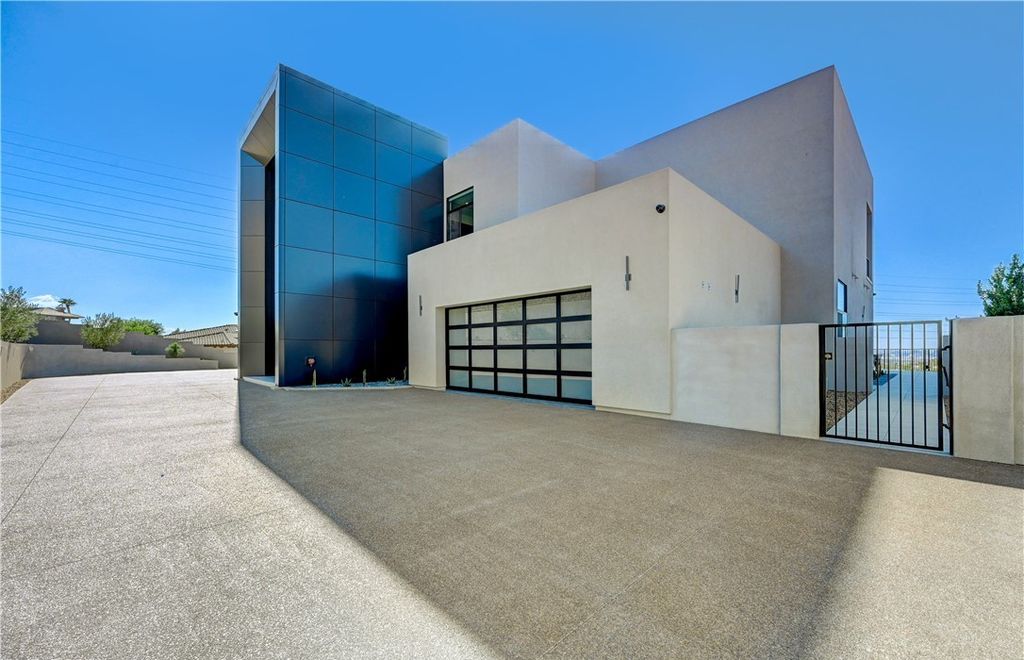 The Home in Henderson, a brand new construction features an open floor plan with modern finishes boasting unobstructed Vegas Strip and mountain views is now available for sale. This home located at 2281 Laughing Water Way, Henderson, Nevada