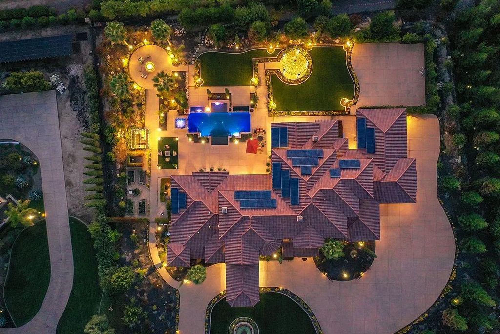 The Estate in Granite Bay, an exquisite Mediterranean retreat accented by the stone, circular driveway, and landscape, boast spacious formal living and dining space with views of the immaculate backyard is now available for sale. This home located at 9010 Chelshire Estates Ct, Granite Bay, California
