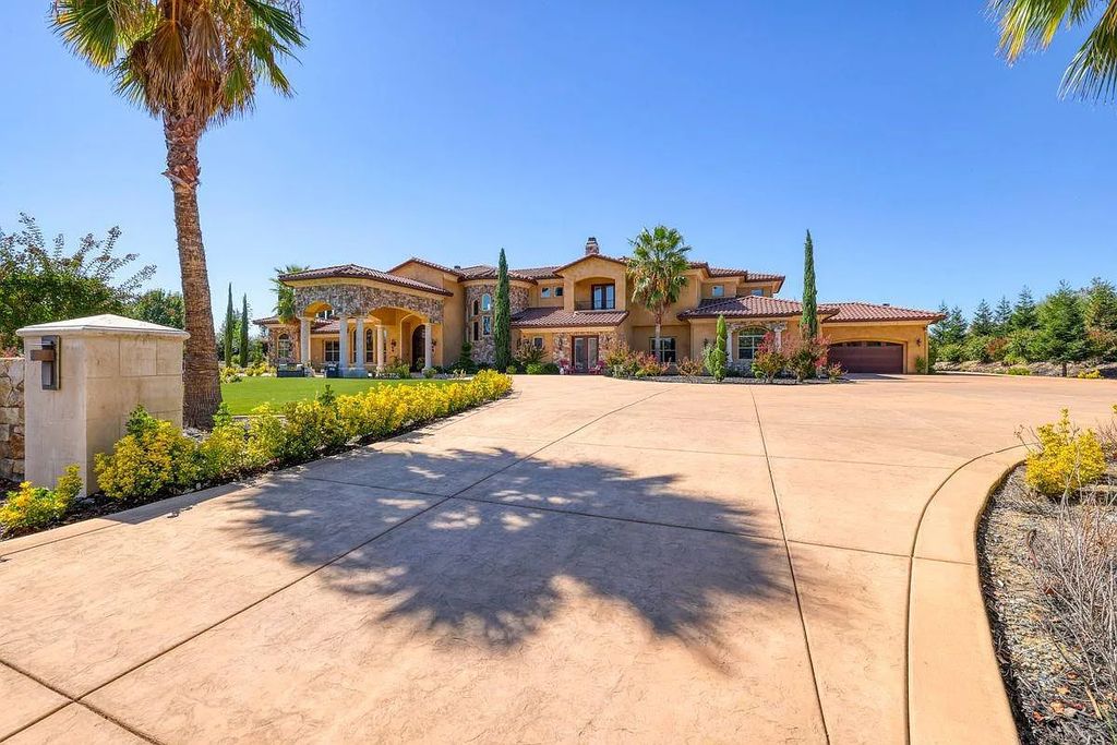 The Estate in Granite Bay, an exquisite Mediterranean retreat accented by the stone, circular driveway, and landscape, boast spacious formal living and dining space with views of the immaculate backyard is now available for sale. This home located at 9010 Chelshire Estates Ct, Granite Bay, California