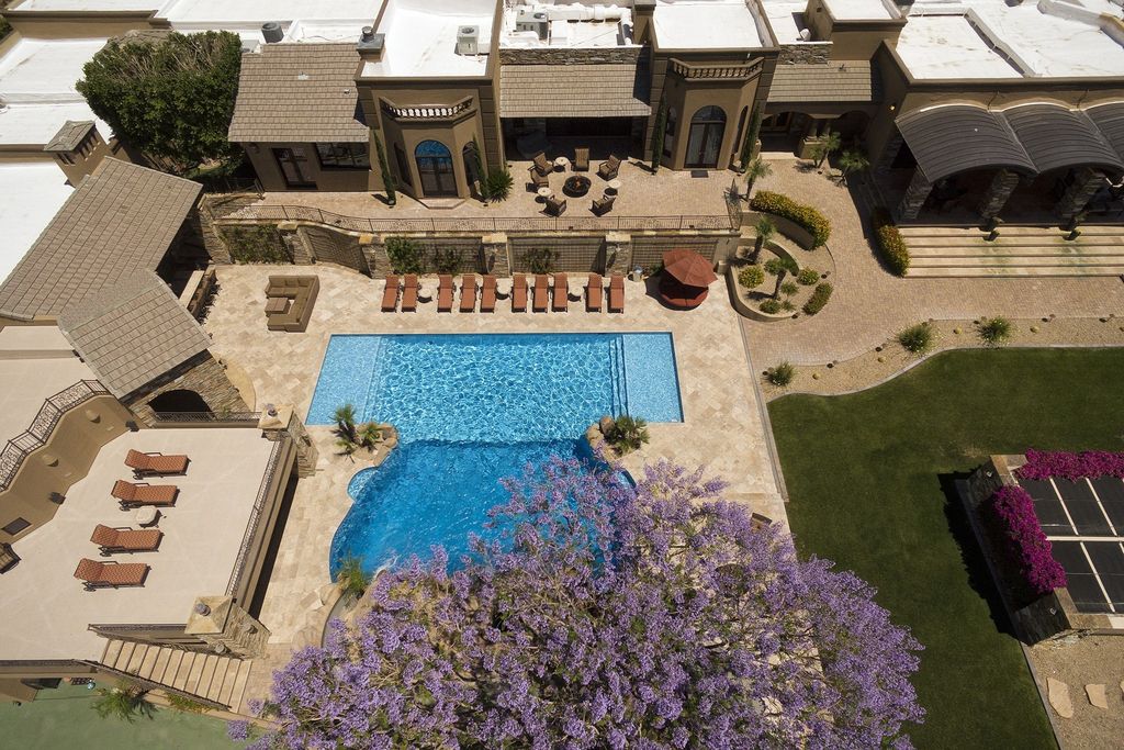 The Home in Scottsdale, a private 8 plus acre estate include every imaginable custom detail offering impeccably manicured grounds with waterfalls and an unbelievable 40 seat theater room is now available for sale. This home located at 23035 N Church Rd, Scottsdale, Arizona
