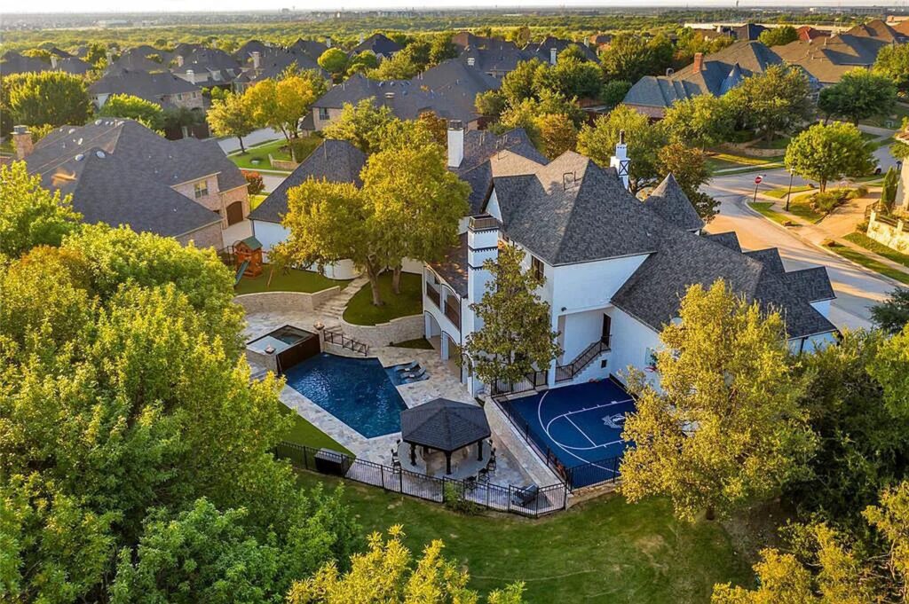The Home in Frisco, an extraordinary modified Tudor style custom estate offers multiple spaces for entertaining and luxury amenities including onsite splash pad, pool and spa, two story terrace with balcony, theater room, game room, wine cellar and more is now available for sale. This home located at 6267 Sweeney Trl, Frisco, Texas