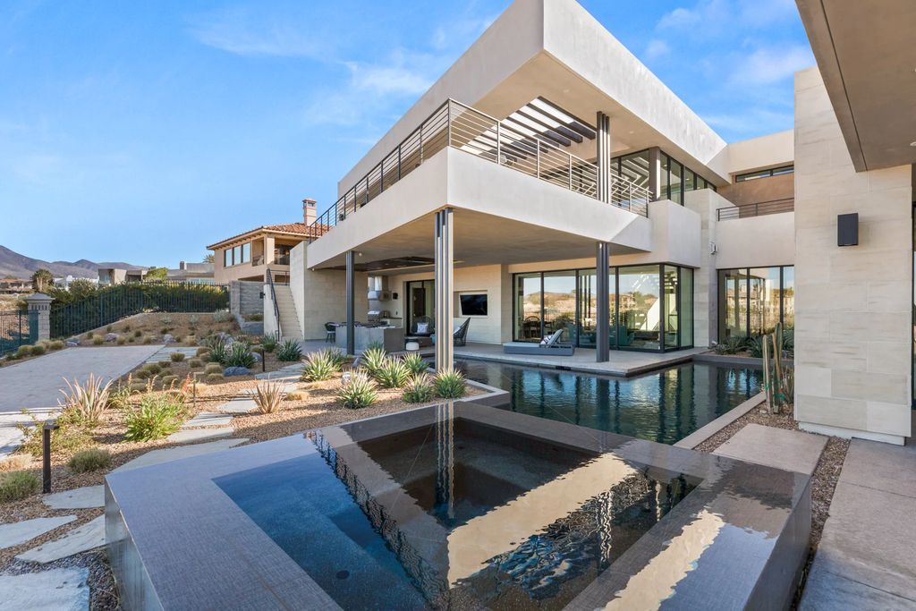 The Home in Henderson, an impressive modern estate with multiple entertaining spaces offering views of the surrounding mountains and serene desertscape is now available for sale. This home located at 1595 Villa Rica Dr, Henderson, Nevada