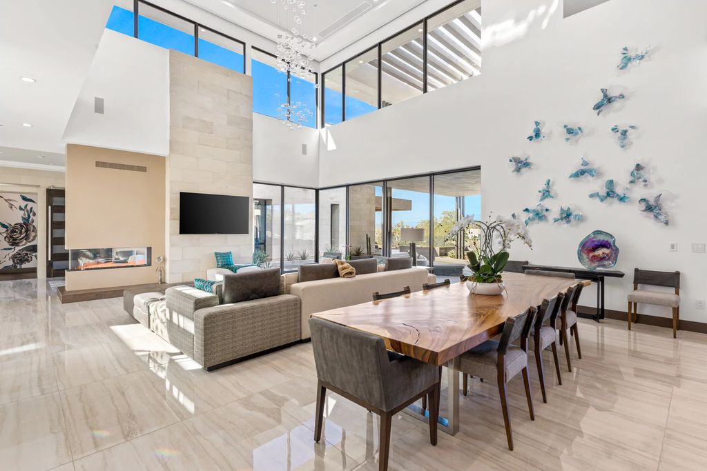 The Home in Henderson, an impressive modern estate with multiple entertaining spaces offering views of the surrounding mountains and serene desertscape is now available for sale. This home located at 1595 Villa Rica Dr, Henderson, Nevada