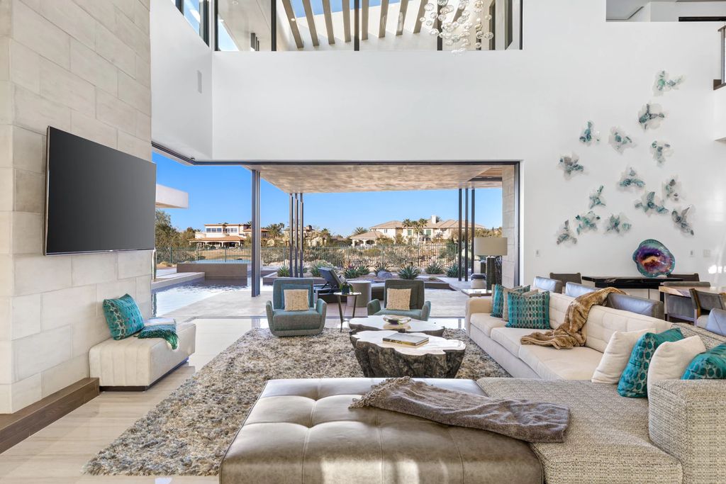 The Home in Henderson, an impressive modern estate with multiple entertaining spaces offering views of the surrounding mountains and serene desertscape is now available for sale. This home located at 1595 Villa Rica Dr, Henderson, Nevada