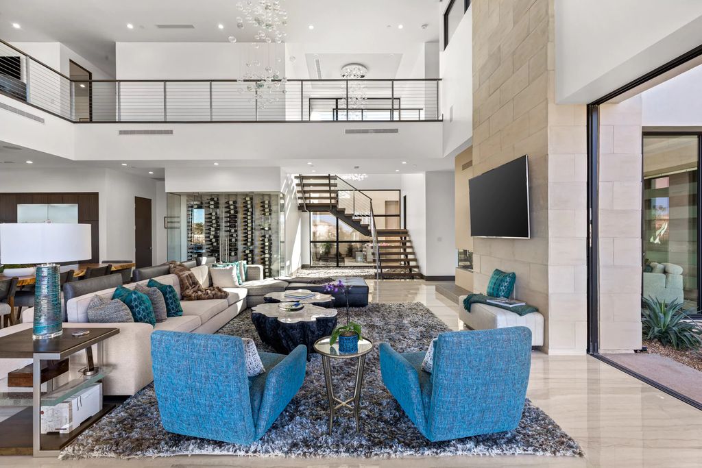 The Home in Henderson, an impressive modern estate with multiple entertaining spaces offering views of the surrounding mountains and serene desertscape is now available for sale. This home located at 1595 Villa Rica Dr, Henderson, Nevada