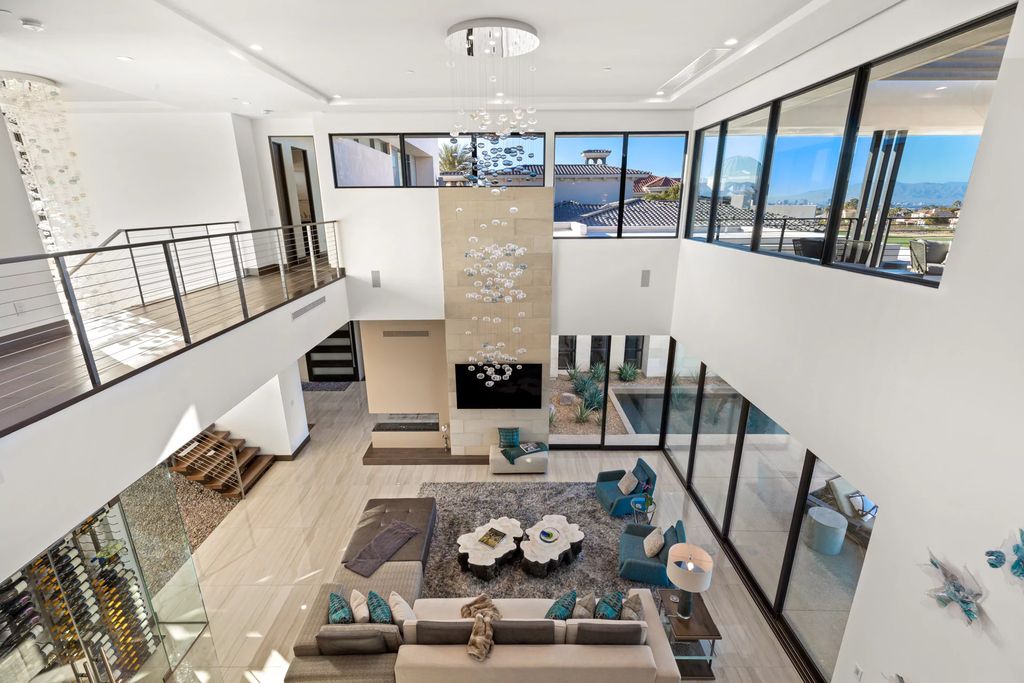 The Home in Henderson, an impressive modern estate with multiple entertaining spaces offering views of the surrounding mountains and serene desertscape is now available for sale. This home located at 1595 Villa Rica Dr, Henderson, Nevada