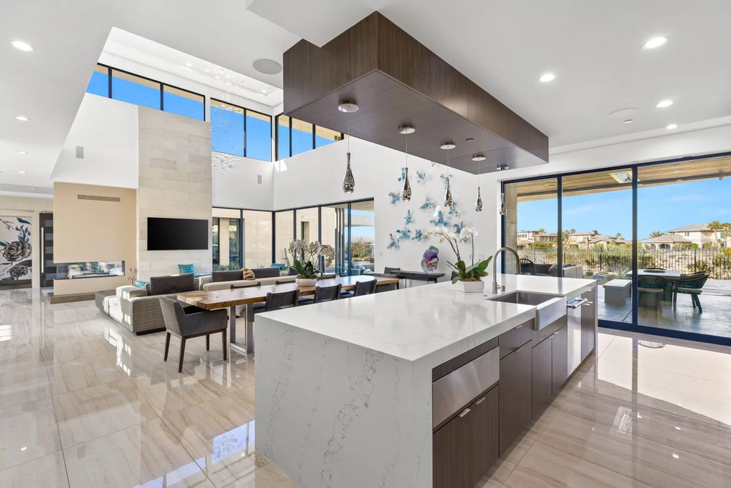 The Home in Henderson, an impressive modern estate with multiple entertaining spaces offering views of the surrounding mountains and serene desertscape is now available for sale. This home located at 1595 Villa Rica Dr, Henderson, Nevada