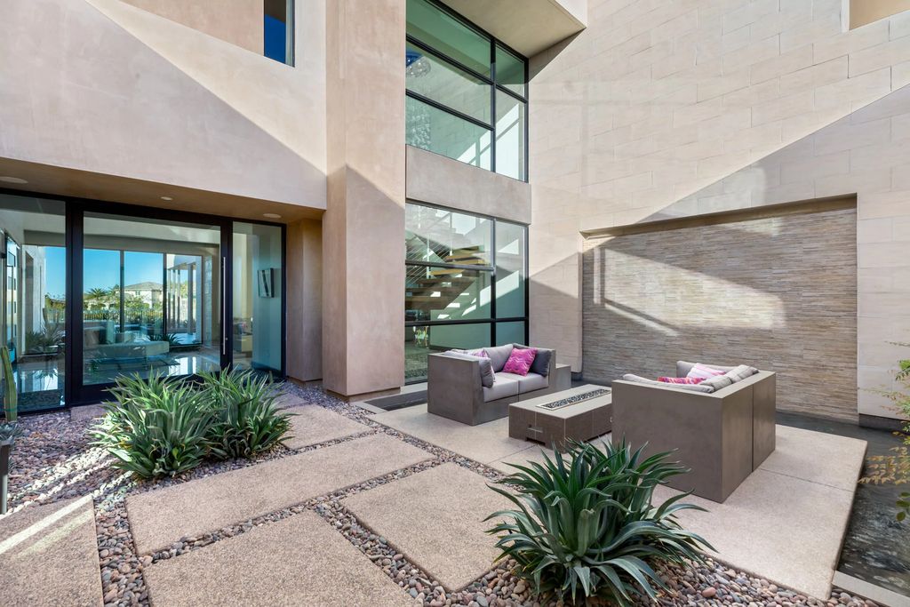 The Home in Henderson, an impressive modern estate with multiple entertaining spaces offering views of the surrounding mountains and serene desertscape is now available for sale. This home located at 1595 Villa Rica Dr, Henderson, Nevada