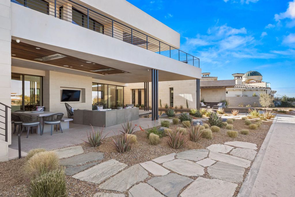 The Home in Henderson, an impressive modern estate with multiple entertaining spaces offering views of the surrounding mountains and serene desertscape is now available for sale. This home located at 1595 Villa Rica Dr, Henderson, Nevada