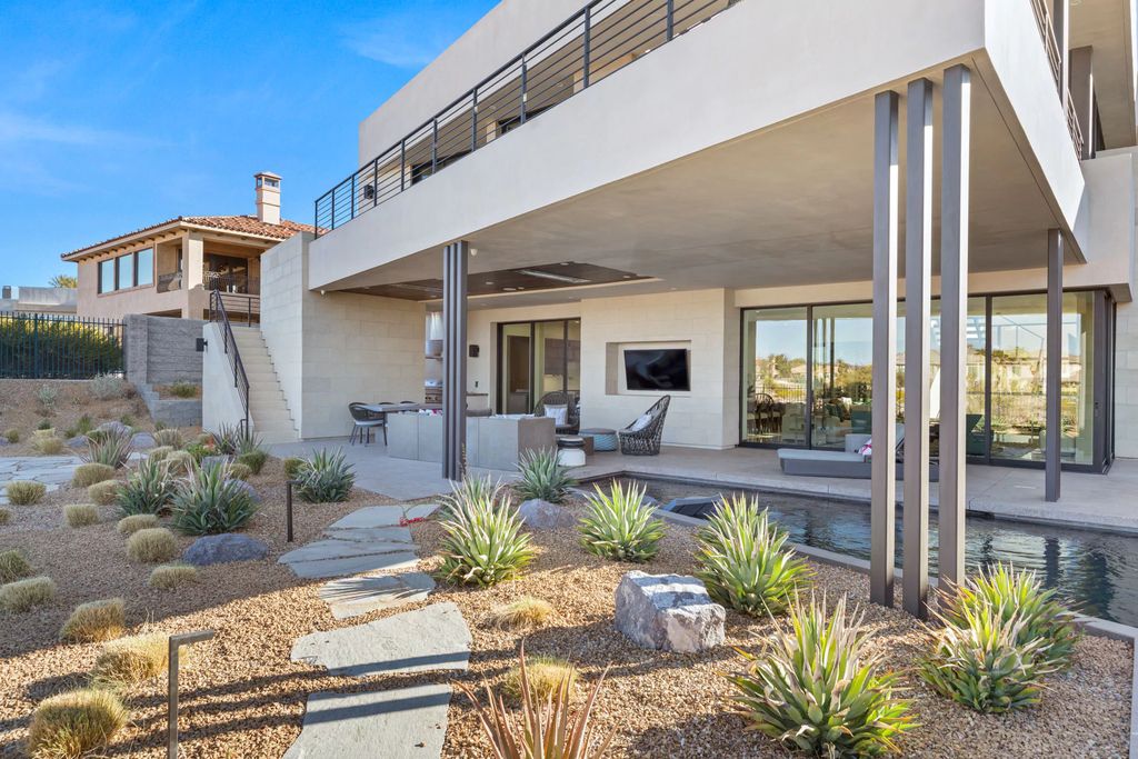 The Home in Henderson, an impressive modern estate with multiple entertaining spaces offering views of the surrounding mountains and serene desertscape is now available for sale. This home located at 1595 Villa Rica Dr, Henderson, Nevada