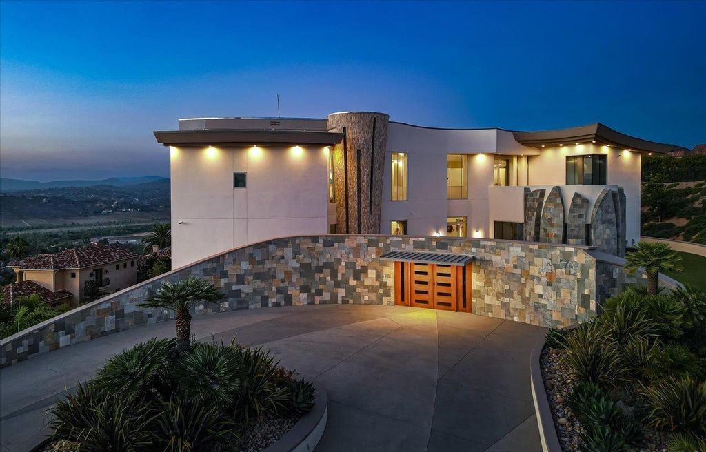 The Home in Poway, a contemporary estate in Highlands Ranch has everything including endless panoramic views of the mountains and nightlights, state of the art amenities and high end finishes is now available for sale. This home located at 13220 Highlands Ranch Rd, Poway, California