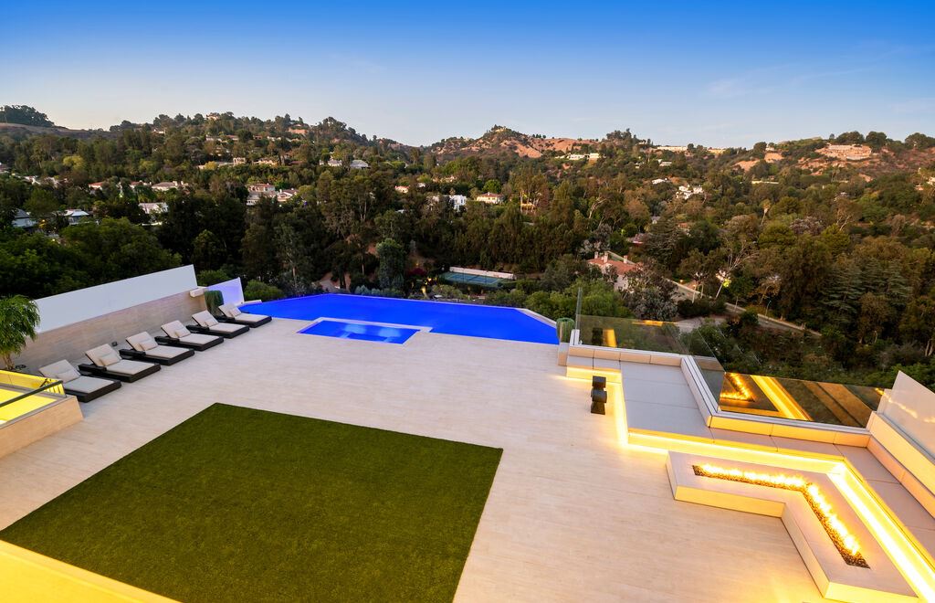 The Beverly Hills Mansion, a gated contemporary home with perfectly scaled living, dining, family room and Chef's eat-in kitchen all open to the breathtaking views is now available for sale. This home located at 2620 Wallingford Dr, Beverly Hills, California