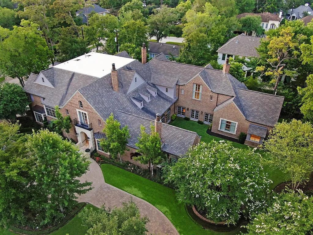 The Estate in Houston, a breathtaking home has loads of curb appeal with meticulously maintained grounds, elegant sconces, and stunning red brick, captivating backyard perfect for entertaining is now available for sale. This home located at 11320 Green Vale Dr, Houston, Texas