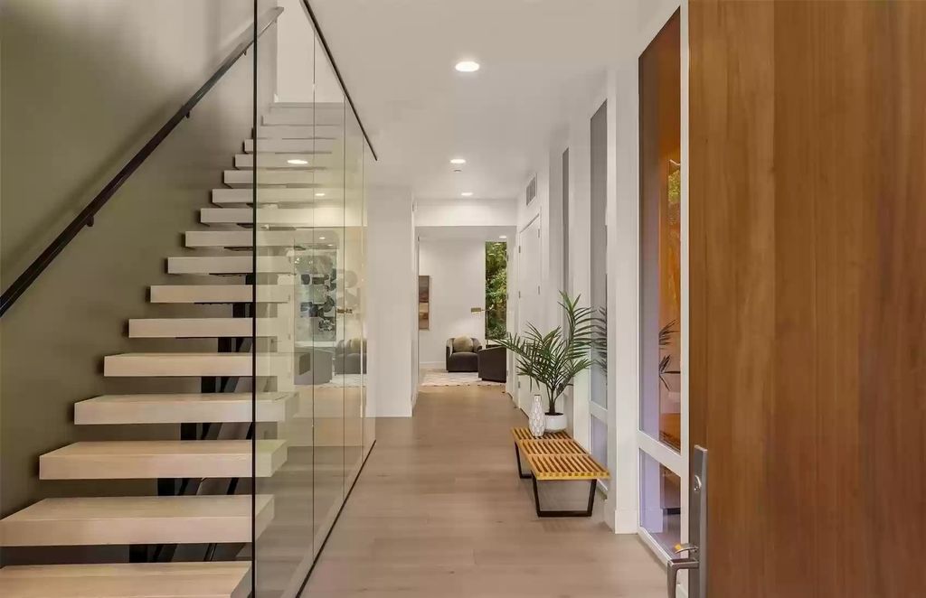 The Home in Bellevue is absolutely stunning with recent high end modern contemporary updates, now available for sale. This home located at 10211 NE 24th Street, Bellevue, Washington