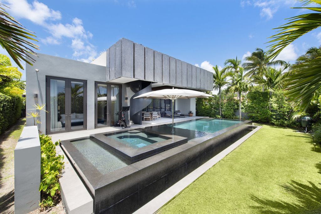 The Villa in Miami Beach, a custom exquisite waterfront home in the prestigious 24H guard gated community Biscayne Pointe offering 60 feet of waterfrontage with new dock is now available for sale. This home located at 8055 Noremac Ave, Miami Beach, Florida