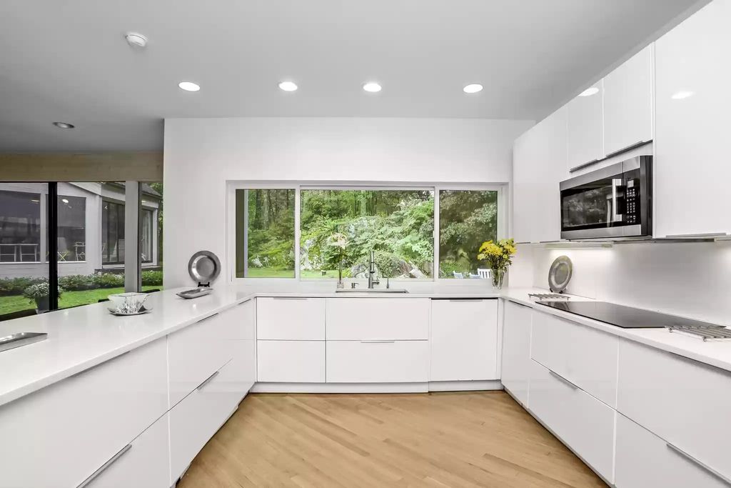 The House in Greenwich blends the verdant outdoors with open living spaces flooded with sunlight, now available for sale. This home located at 48 Lafrentz Rd, Greenwich, Connecticut