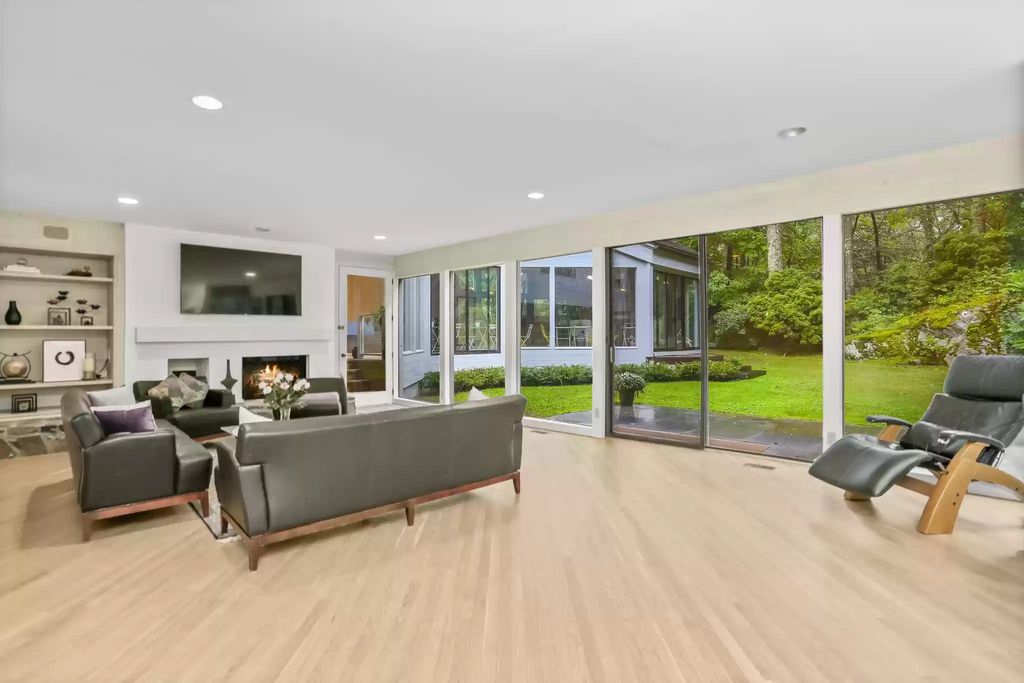 The House in Greenwich blends the verdant outdoors with open living spaces flooded with sunlight, now available for sale. This home located at 48 Lafrentz Rd, Greenwich, Connecticut