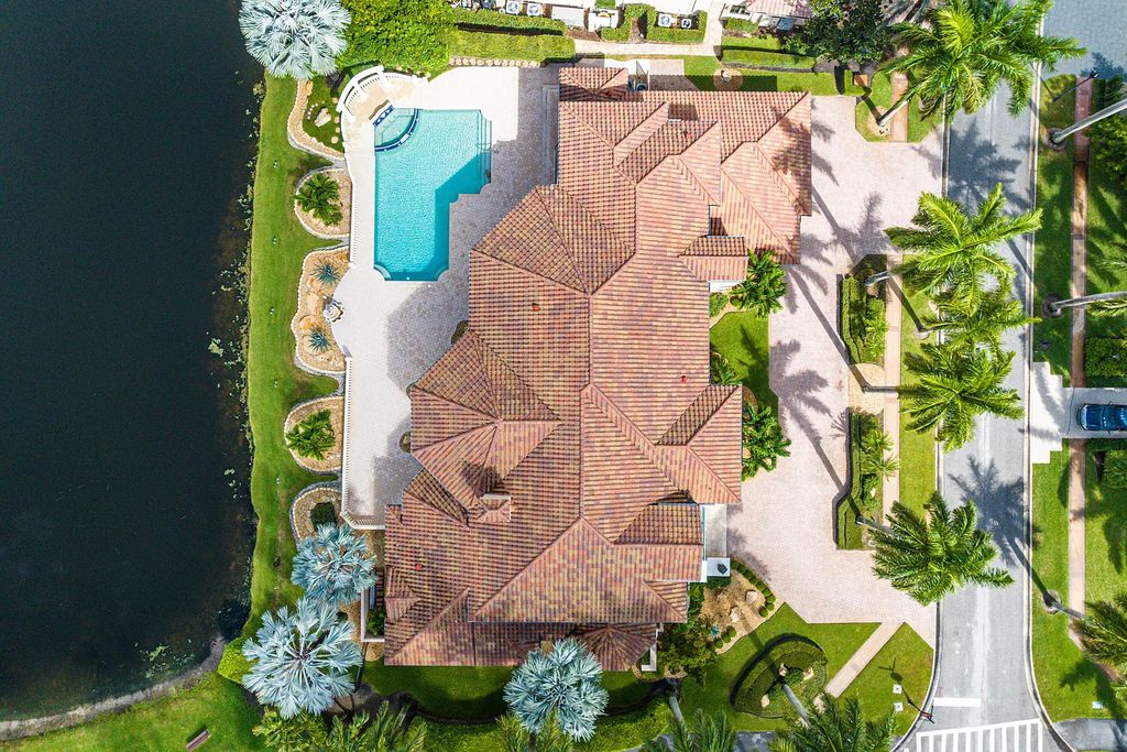 The Home in Boca Raton, a Custom Palm Beach inspired estate with large circular driveway and a large pool and spa all overlooking the breathtaking lakes and fairways of St Andrews Country Club is now available for sale. This home located at 17037 Brookwood Dr, Boca Raton, Florida