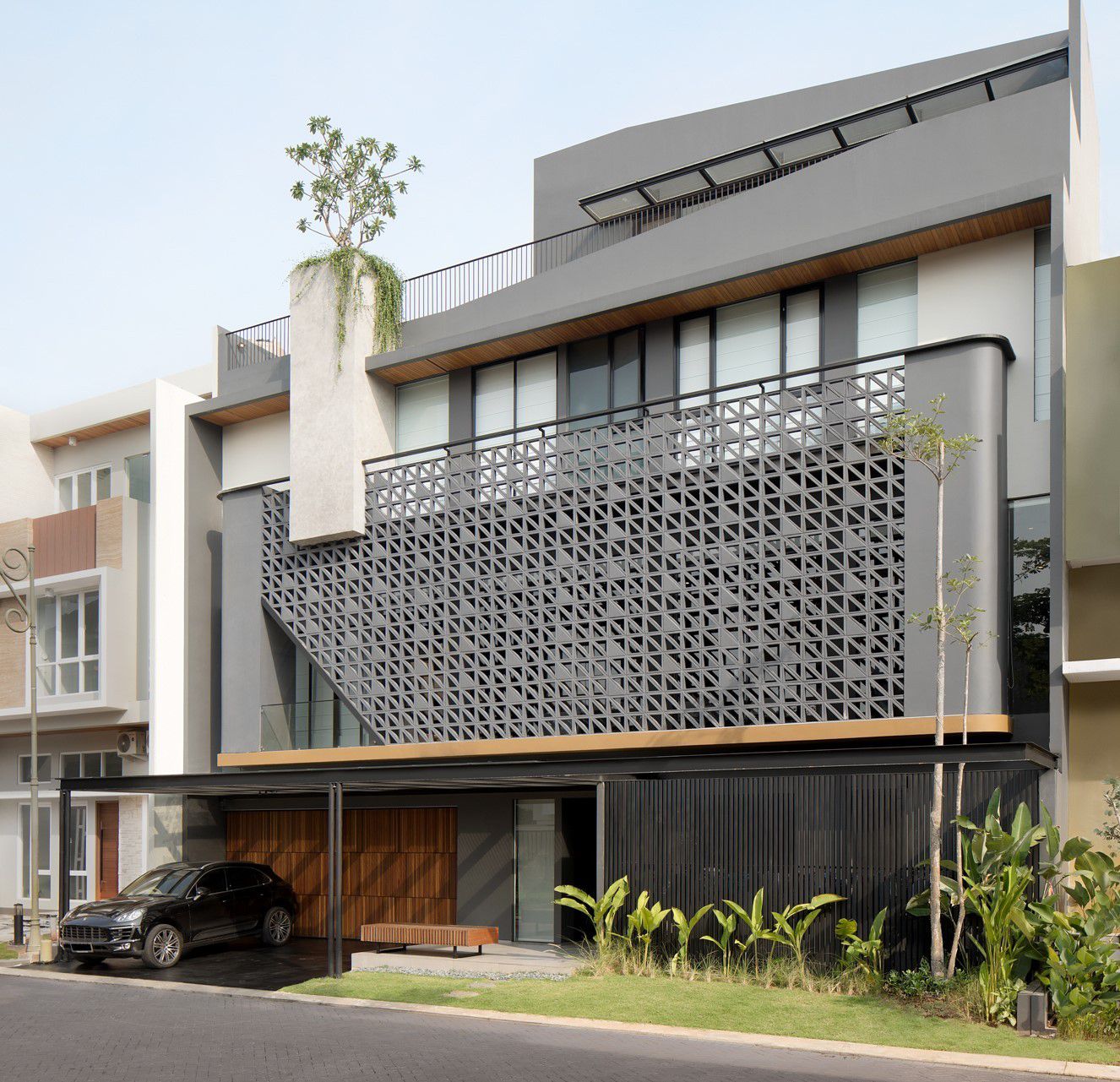 HM House, a Prominent Grey-Structured Three-storey by Axial Studio