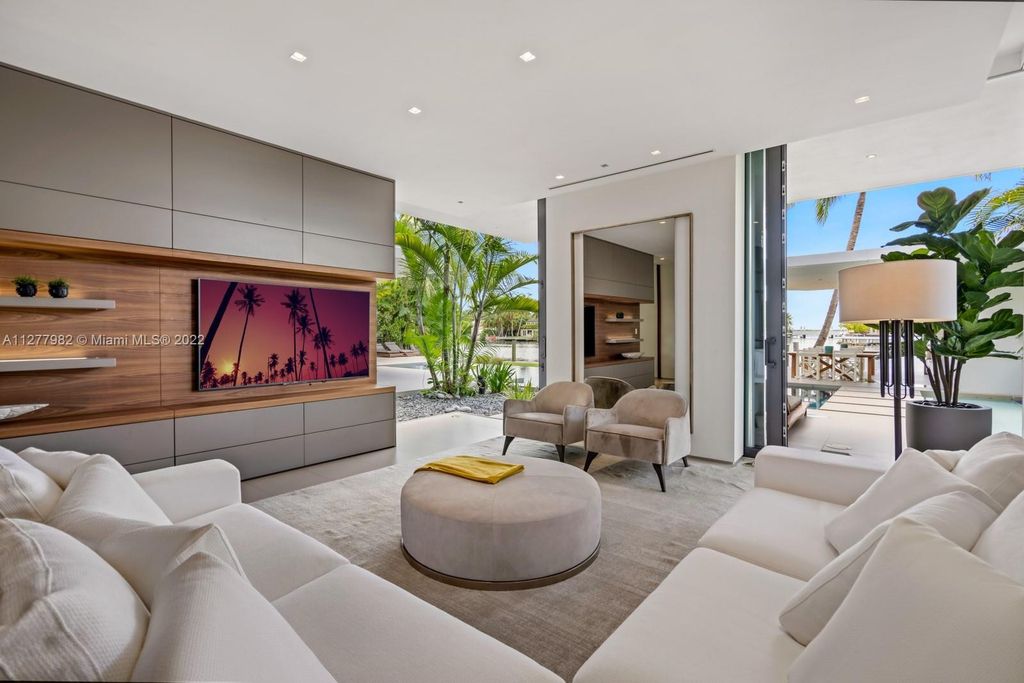 The Miami Beach Home, a tropical modern masterpiece with 110 foot of water frontage designed by Choeff Levy Fischman featuring luxurious amenities for extraordinary Florida waterfront living is now available for sale. This home located at 6480 Allison Rd, Miami Beach, Florida